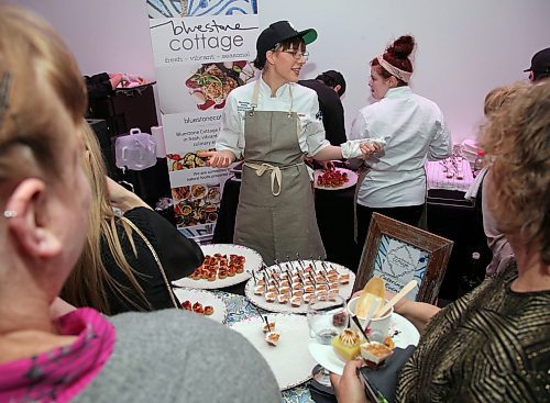 JASON HALSTEAD / WINNIPEG FREE PRESS

Kelly Cattani of Bluestone Cottage serves attendees at the Women, Wine and Food for International Women's Day event hosted by the Women's Health Clinic at the Manitoba Museums Alloway Hall on March 7, 2020. (See Social Page)