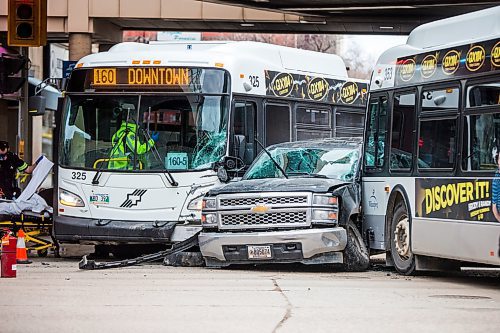 MIKAELA MACKENZIE / WINNIPEG FREE PRESS

An accident involving two city buses and a truck at Portage Avenue and Vaughan Street in Winnipeg on Tuesday, April 7, 2020. 
Winnipeg Free Press 2020