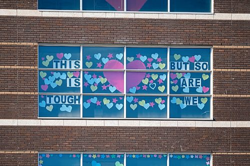 Daniel Crump / Winnipeg Free Press. Hearts and signs with messages of encouragement can be seen adorning the south side of the Grace Hospital, from Portage Avenue. April 10, 2020.