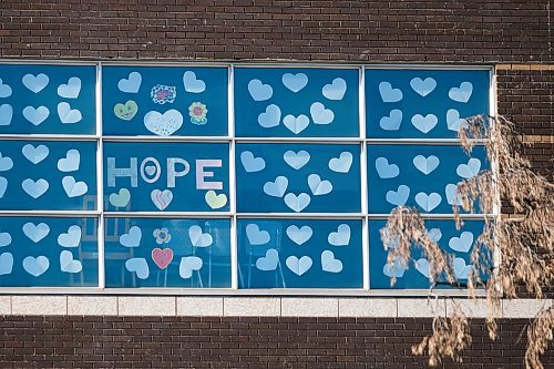 Daniel Crump / Winnipeg Free Press. Hearts and signs with messages of encouragement can be seen adorning the south side of the Grace Hospital, from Portage Avenue. April 10, 2020.