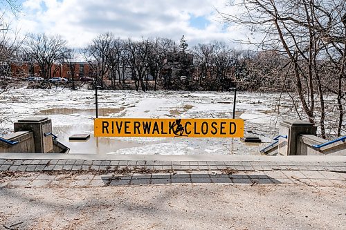 Daniel Crump / Winnipeg Free Press. The Assiniboine River walk heading west from the Forks is closed due to high water levels. April 11, 2020.