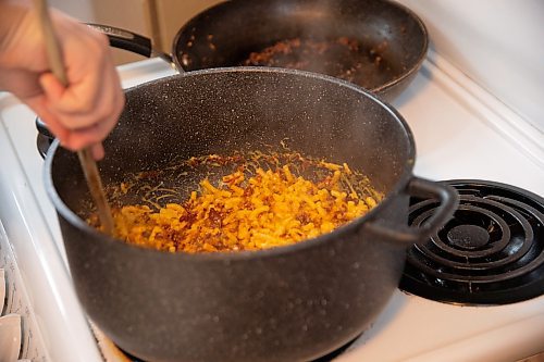 Mike Sudoma / Winnipeg Free Press
Deer and Almond Sous Chef, Stefan Lytwyn stirs up his own take on Kraft Dinner inside his apartment kitchen Tuesday afternoon
April 14, 2020