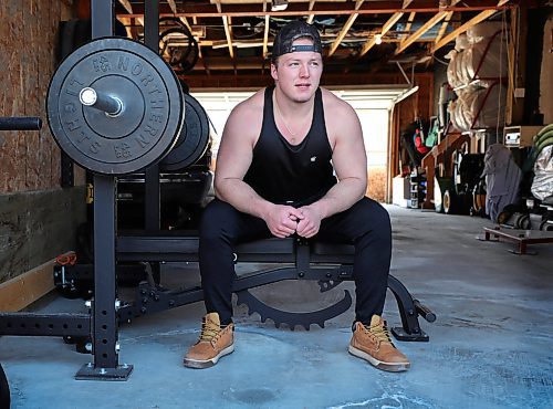 RUTH BONNEVILLE  /  WINNIPEG FREE PRESS 

SPORTS - pandemic athletes

Feature on athletes like, Bisons footballer Brody Williams, coping with the pandemic.

Feature photos of  Bisons footballer, Brody Williams, working out in his garage with a home-made prawler and at the squat rack at his home in Oakbank Manitoba on Wednesday. 

Mike Sawatzky story. 

April 15h,  2020