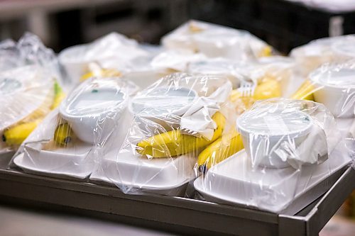 MIKAELA MACKENZIE / WINNIPEG FREE PRESS

Free lunches get packaged up at the Knox Church community kitchen in Winnipeg on Wednesday, April 15, 2020. For Brenda Suderman story.
Winnipeg Free Press 2020