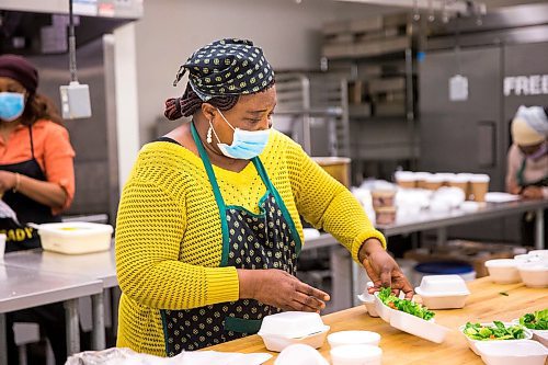 MIKAELA MACKENZIE / WINNIPEG FREE PRESS

Melrose Koineh packages up free lunches at the Knox Church community kitchen in Winnipeg on Wednesday, April 15, 2020. For Brenda Suderman story.
Winnipeg Free Press 2020