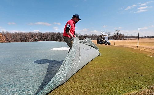RUTH BONNEVILLE  /  WINNIPEG FREE PRESS 

SPORTS - Golf Greens 

Dustin How, Superintendent of Southwood Golf Course, says their golf course is in better shape than ever, as he uncovers the green on the 18th hole on Wednesday.  

See Mike McIntyre story. 

April 15h,  2020
