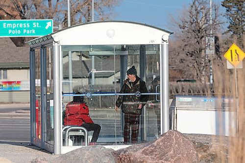 SHANNON VANRAES / WINNIPEG FREE PRESS
A handful of people wait in a bus shack near Polo Park CF mall on April 17, 2020.