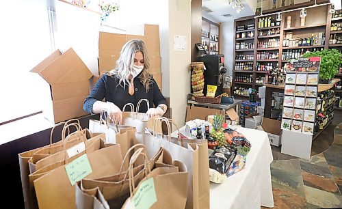 RUTH BONNEVILLE  /  WINNIPEG FREE PRESS 


Biz - Deluca's e-commerce

Carla De Luca packs on-line grocery orders into bags at the Portage Ave. Store.


Subject: Story is on significant up-tick in the use of e-commerce. Deluca's is now doing grocery orders on-line for delivery.


April 21st,  2020
