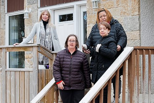 JOHN WOODS / WINNIPEG FREE PRESS
Karen Fonseth, CEO of DASCH, left, and Ethel Lopez, manager of a DASCH home in Charleswood, are photographed with residents Ashley and Val at their group home Tuesday, April 21, 2020. 

Reporter: Alan