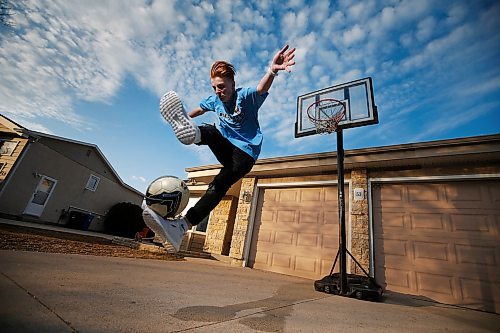 JOHN WOODS / WINNIPEG FREE PRESS
Ethan Hogsden, 15, a minor soccer player with the Winnipeg Phoenix FC, practices on his driveway in Winnipeg Tuesday, April 21, 2020. COVID-19 has shutdown minor sports and left young players to their own devices.

Reporter: Bell