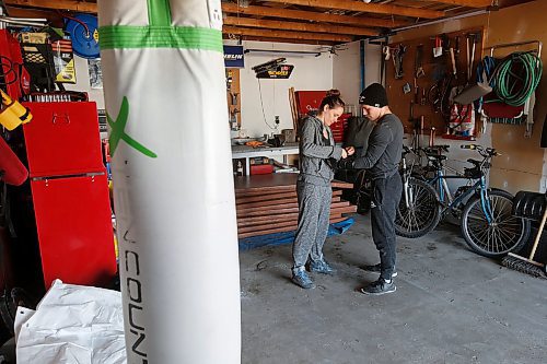 JOHN WOODS / WINNIPEG FREE PRESS
MMA fighter Brad Katona works out in his garage in Winnipeg with his girlfriend and fighter Katie Saull Wednesday, April 22, 2020. Katona was training in Ireland at Conor McGregors gym in Dublin. COVID-19 has shut everything down and Katona returned to Winnipeg to train.

Reporter: Allen