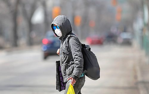 RUTH BONNEVILLE  /  WINNIPEG FREE PRESS 

LOCAL -  Broadway with COVID 

Photo of a person making their way across Broadway Ave. protected with a mask, hood and sunglasses amidst a desolate surrounding on a beautiful, spring day over the lunch hour on Friday

Normally Broadway is a bustling mecca of  food trucks, area workers enjoying their lunch and pedestrians filling the sidewalks, but now is a dusty and forlorn avenue during COVID-19 crisis.   

   
April 24th,  2020
