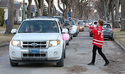 JASON HALSTEAD / WINNIPEG FREE PRESS

Sandy Cook, who retired as a corrections officer at Headingley Correctional Centre on April 24, 2020, greets well-wishers during a vehicle parade in front of her West End home the same day. (See Waldman story)