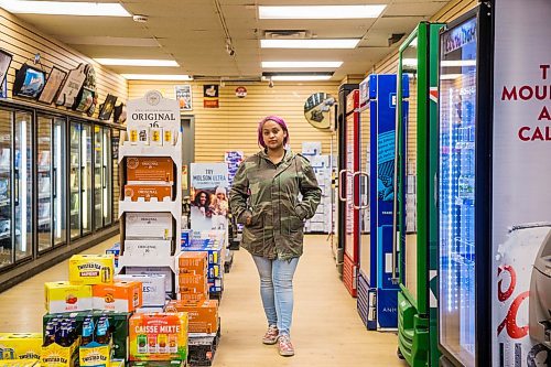 MIKAELA MACKENZIE / WINNIPEG FREE PRESS

Mercedes Hall, acting manager of the Norwood Hotel  Beer Store, poses for a portrait among the empty fridges in Winnipeg on Tuesday, April 28, 2020. They've had to unplug seven fridges because there isn't stock to fill them with. For Eva Wasney story.

Winnipeg Free Press 2020