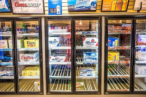 MIKAELA MACKENZIE / WINNIPEG FREE PRESS

Empty shelves at the Norwood Hotel  Beer Store, which is experiencing beer shortages, in Winnipeg on Tuesday, April 28, 2020. They've had to unplug seven fridges because there isn't stock to fill them with. For Eva Wasney story.

Winnipeg Free Press 2020