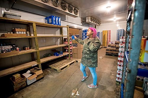 MIKAELA MACKENZIE / WINNIPEG FREE PRESS

Mercedes Hall, acting manager of the Norwood Hotel  Beer Store, shows empty shelves in the back room in Winnipeg on Tuesday, April 28, 2020. They've had to unplug seven fridges because there isn't stock to fill them with. For Eva Wasney story.

Winnipeg Free Press 2020
