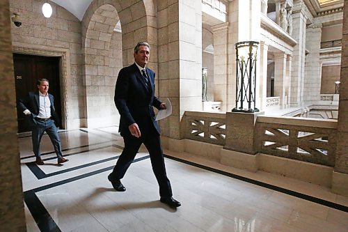 MIKE DEAL / WINNIPEG FREE PRESS
Premier Brian Pallister heads to his media conference in the Manitoba legislative building where he announced his plan to start easing restrictions on businesses during the COVID-19 pandemic. 
200429 - Wednesday, April 29, 2020.