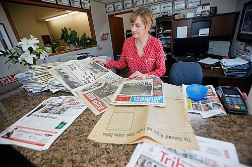 JOHN WOODS / WINNIPEG FREE PRESS
Lana Meier, owner of Big And Colourful Printing and Publishing which publishes Selkirk Record, Winkler-Morden Voice, The Express Weekly News and the Stonewall-Teulon Tribune, along with Interlake Graphics looks through old newspapers in her office in Stonewall Wednesday, April 29, 2020. Tuesday, Postmedia shut down every community paper in Manitoba except for the Portage Daily Graphic; all of Meiers papers are still kicking.

Reporter: Waldman
