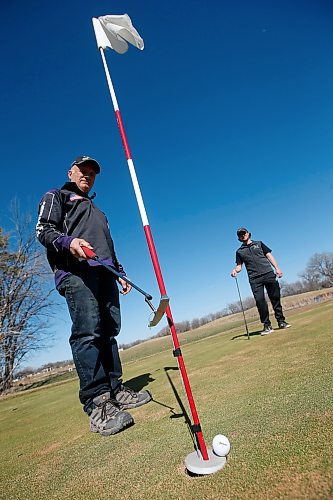 JOHN WOODS / WINNIPEG FREE PRESS
Guido Cerasani, owner of Shooters Golf, and his son Eason who have developed a contraption to allow golfers to remove their ball without touching the flag pole are photographed Wednesday, April 29, 2020. Golf courses will be allowed to open next week under restrictions of four per group and one per cart.

Reporter: Allen