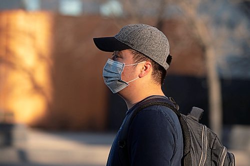 Mike Sudoma / Winnipeg Free Press
Le waits for his bus in front of City Hall on Main St Tuesday evening
April 29, 2020