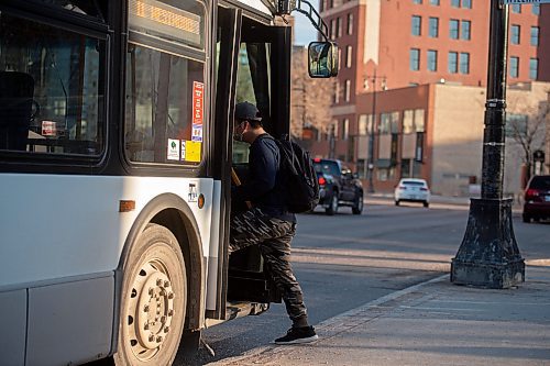 Mike Sudoma / Winnipeg Free Press
Le waits gets on his bus in front of City Hall on Main St Tuesday evening
April 29, 2020