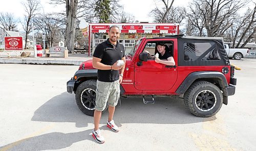 RUTH BONNEVILLE  /  WINNIPEG FREE PRESS 


BIZ - BDI

Justin Jacob, co-owner of BDI (Bridge Drive-In) illustrates with his employee, Riley Gibbons (in his vehicle), how he plans to create a drive-thru ordering system to operate his business for the first stage of opening their ice cream business.  Jacob's plans to open the BDI on Monday.  

Story: Talking to local seasonal eateries about how they plan to stay afloat over the summer

See Malak story. ?
April 30th,  2020

