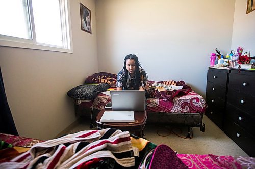 MIKAELA MACKENZIE / WINNIPEG FREE PRESS

Nyat Birhane, a grade 11 student at St. John's High School, poses for a portrait in her home in Winnipeg on Thursday, April 30, 2020. Nyat and her older sister do their schoolwork in the bedroom, where they also share a laptop. For Maggie Macintosh story.

Winnipeg Free Press 2020