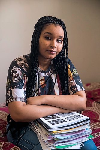 MIKAELA MACKENZIE / WINNIPEG FREE PRESS

Nyat Birhane, a grade 11 student at St. John's High School, poses for a portrait in her home in Winnipeg on Thursday, April 30, 2020. Nyat and her older sister do their schoolwork in the bedroom, where they also share a laptop. For Maggie Macintosh story.

Winnipeg Free Press 2020