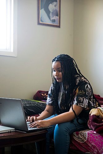 MIKAELA MACKENZIE / WINNIPEG FREE PRESS

Nyat Birhane, a grade 11 student at St. John's High School, poses for a portrait in her home in Winnipeg on Thursday, April 30, 2020. Nyat and her older sister do their schoolwork in the bedroom, where they also share a laptop. For Maggie Macintosh story.

Winnipeg Free Press 2020