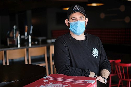 Daniel Crump / Winnipeg Free Press. Dave Fox, owner of A Little Pizza Heaven, wears a protective mask as he poses for a photo at his Madison Square location. April 30, 2020.