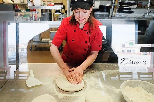 Daniel Crump / Winnipeg Free Press. Diana Cline, of Dianas Cucina and Lounge, kneads some pizza doh in her shop on St. Anness Road in South Winnipeg. April 30, 2020.