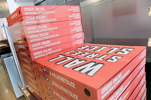Daniel Crump / Winnipeg Free Press. Delivery boxes stacked at Wall Street Slice. The shop allows customers to mix and match slices to make a whole 18-inch pizza. April 30, 2020.