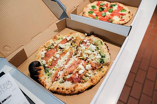 Daniel Crump / Winnipeg Free Press. A Waterloo (left) and margherita pizza in take out boxes at Pizzeria Gusto. April 30, 2020.