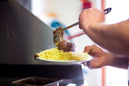 MIKAELA MACKENZIE / WINNIPEG FREE PRESS

Fraser Mason, owner of Sandy Lou's Diner, puts together a plate of Cincinnati-style chili in Winnipeg on Friday, May 1, 2020. The diner's only been open six months, but has already had its share of adversity, first getting into a dispute with their original landlord at a downtown hotel, forcing them to vacate that premises after only three months, then getting hit with COVID two weeks after opening at their second location, inside the LaSalle Hotel. For Dave Sanderson story.

Winnipeg Free Press 2020