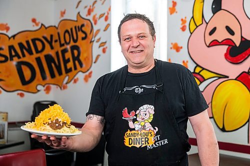 MIKAELA MACKENZIE / WINNIPEG FREE PRESS

Fraser Mason, owner of Sandy Lou's Diner, shows off a plate of Cincinnati-style chili in Winnipeg on Friday, May 1, 2020. The diner's only been open six months, but has already had its share of adversity, first getting into a dispute with their original landlord at a downtown hotel, forcing them to vacate that premises after only three months, then getting hit with COVID two weeks after opening at their second location, inside the LaSalle Hotel. For Dave Sanderson story.

Winnipeg Free Press 2020