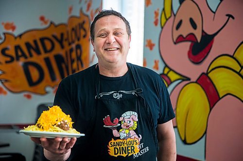 MIKAELA MACKENZIE / WINNIPEG FREE PRESS

Fraser Mason, owner of Sandy Lou's Diner, shows off a plate of Cincinnati-style chili in Winnipeg on Friday, May 1, 2020. The diner's only been open six months, but has already had its share of adversity, first getting into a dispute with their original landlord at a downtown hotel, forcing them to vacate that premises after only three months, then getting hit with COVID two weeks after opening at their second location, inside the LaSalle Hotel. For Dave Sanderson story.

Winnipeg Free Press 2020