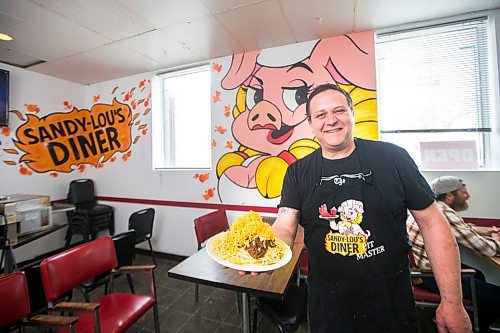 MIKAELA MACKENZIE / WINNIPEG FREE PRESS

Fraser Mason, owner of Sandy Lou's Diner, shows off a plate of Cincinnati-style chili in Winnipeg on Friday, May 1, 2020. The diner's only been open six months, but has already had its share of adversity, first getting into a dispute with their original landlord at a downtown hotel, forcing them to vacate that premises after only three months, then getting hit with COVID two weeks after opening at their second location, inside the LaSalle Hotel. For Dave Sanderson story.

Winnipeg Free Press 2020