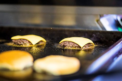 MIKAELA MACKENZIE / WINNIPEG FREE PRESS

Fraser Mason, owner of Sandy Lou's Diner, makes burgers in Winnipeg on Friday, May 1, 2020. The diner's only been open six months, but has already had its share of adversity, first getting into a dispute with their original landlord at a downtown hotel, forcing them to vacate that premises after only three months, then getting hit with COVID two weeks after opening at their second location, inside the LaSalle Hotel. For Dave Sanderson story.

Winnipeg Free Press 2020