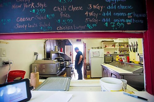 MIKAELA MACKENZIE / WINNIPEG FREE PRESS

Fraser Mason, owner of Sandy Lou's Diner, makes burgers in Winnipeg on Friday, May 1, 2020. The diner's only been open six months, but has already had its share of adversity, first getting into a dispute with their original landlord at a downtown hotel, forcing them to vacate that premises after only three months, then getting hit with COVID two weeks after opening at their second location, inside the LaSalle Hotel. For Dave Sanderson story.

Winnipeg Free Press 2020