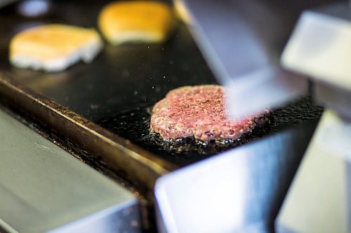 MIKAELA MACKENZIE / WINNIPEG FREE PRESS

Fraser Mason, owner of Sandy Lou's Diner, makes burgers in Winnipeg on Friday, May 1, 2020. The diner's only been open six months, but has already had its share of adversity, first getting into a dispute with their original landlord at a downtown hotel, forcing them to vacate that premises after only three months, then getting hit with COVID two weeks after opening at their second location, inside the LaSalle Hotel. For Dave Sanderson story.

Winnipeg Free Press 2020