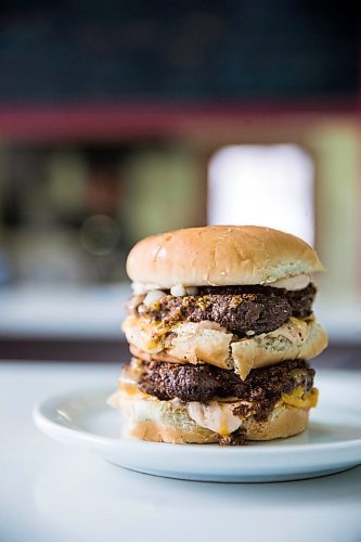 MIKAELA MACKENZIE / WINNIPEG FREE PRESS

A double cheeseburger at Sandy Lou's Diner in Winnipeg on Friday, May 1, 2020. The diner's only been open six months, but has already had its share of adversity, first getting into a dispute with their original landlord at a downtown hotel, forcing them to vacate that premises after only three months, then getting hit with COVID two weeks after opening at their second location, inside the LaSalle Hotel. For Dave Sanderson story.

Winnipeg Free Press 2020