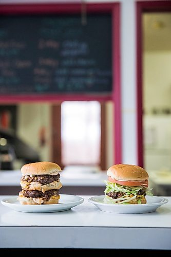 MIKAELA MACKENZIE / WINNIPEG FREE PRESS

A double cheeseburger (left) and a fatboy at Sandy Lou's Diner in Winnipeg on Friday, May 1, 2020. The diner's only been open six months, but has already had its share of adversity, first getting into a dispute with their original landlord at a downtown hotel, forcing them to vacate that premises after only three months, then getting hit with COVID two weeks after opening at their second location, inside the LaSalle Hotel. For Dave Sanderson story.

Winnipeg Free Press 2020