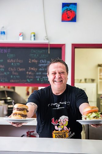 MIKAELA MACKENZIE / WINNIPEG FREE PRESS

Fraser Mason, owner of Sandy Lou's Diner, poses for a portrait with a double cheeseburger and a fatboy in Winnipeg on Friday, May 1, 2020. The diner's only been open six months, but has already had its share of adversity, first getting into a dispute with their original landlord at a downtown hotel, forcing them to vacate that premises after only three months, then getting hit with COVID two weeks after opening at their second location, inside the LaSalle Hotel. For Dave Sanderson story.

Winnipeg Free Press 2020