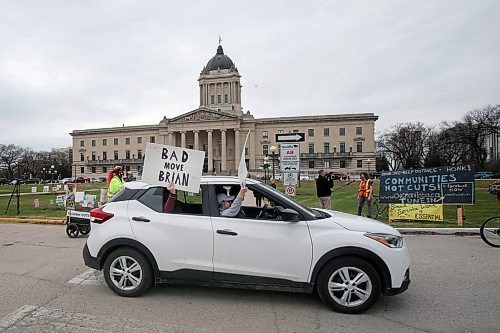SHANNON VANRAES / WINNIPEG FREE PRESS
Communities Not Cuts organized a "honk-a-thon" at the Manitoba Legislature on May 1, 2020, to protest job cuts at universities, crown corporations and elsewhere in the civil service. A few hundred people in vehicles and on bikes circled the legislative building, holding signs, honking horns and ringing bells over the noon-hour.