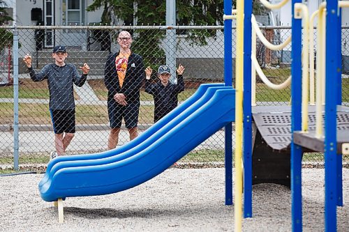 MIKE DEAL / WINNIPEG FREE PRESS
Darren Thomas a risk manager for Manitoba School Boards Association, with his sons, Carson, 12, and Owen, 8, looking longingly at Montrose School playground equipment which they will not be able to use Monday when the province makes it allowable. 
Thomas said theres too  much risk and liability to reopen school playgrounds right now. They wont reopen until they get clear guidance from public health or the return of laid-off maintenance staff who can make sure the equipment is safe, never mind disinfected.
See Carol Sanders story
200501 - Friday, May 01, 2020.