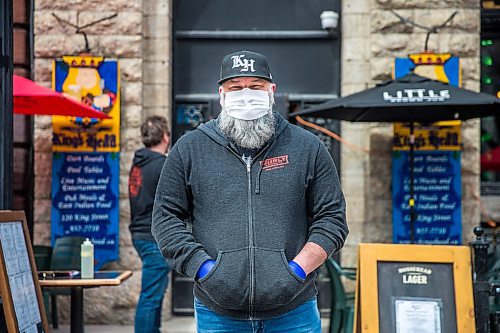 MIKAELA MACKENZIE / WINNIPEG FREE PRESS

Chris Graves, owner of the King's Head, on the newly opened patio in Winnipeg on Monday, May 4, 2020. For JS story.

Winnipeg Free Press 2020