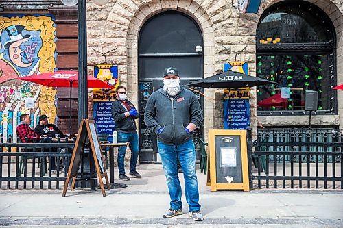 MIKAELA MACKENZIE / WINNIPEG FREE PRESS

Chris Graves, owner of the King's Head, on the newly opened patio in Winnipeg on Monday, May 4, 2020. For JS story.

Winnipeg Free Press 2020