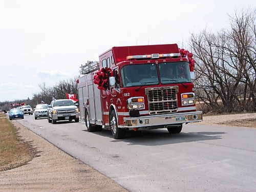 Canstar Community News April 26, 2020 - Headingley fire department members, first responders, and police drove their vehicles through the municipality on April 26 with lights flashing and sirens on in the Hugs from Headingley event. (ANDREA GEARY/CANSTAR COMMUNITY NEWS)