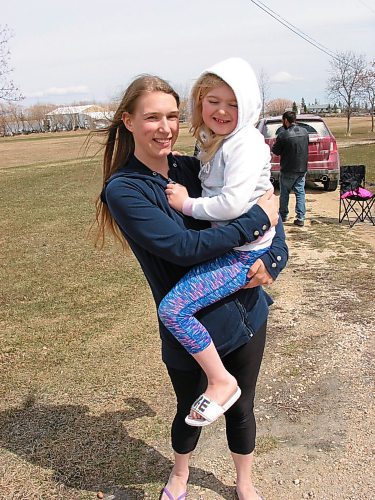 Canstar Community News April 26, 2020 - Natalie Drummond, shown with her mom, was serenaded by Headingley fire department members, first responders, and police, on April 26 to help the six-year-old celebrate her birthday. (ANDREA GEARY/CANSTAR COMMUNITY NEWS)