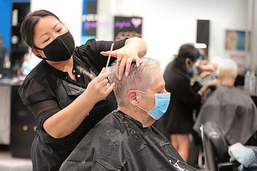 RUTH BONNEVILLE  /  WINNIPEG FREE PRESS 

Local - Hair salons open after COVID closures
 
Hair stylist Julie Louangxay cuts a clients hair at Revolutions Hair Salon in Polo Park Mall on their re-opening day on Monday. 

Eva Wasney 
Reporter, Winnipeg Free Press

May 4th,  2020
